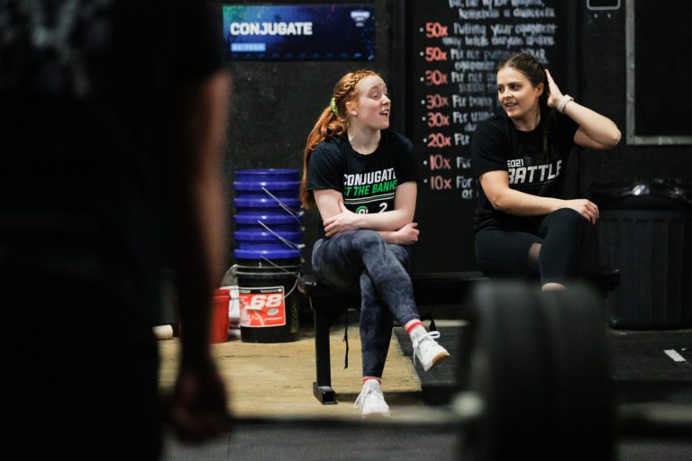 CrossFit athletes talk after a workout